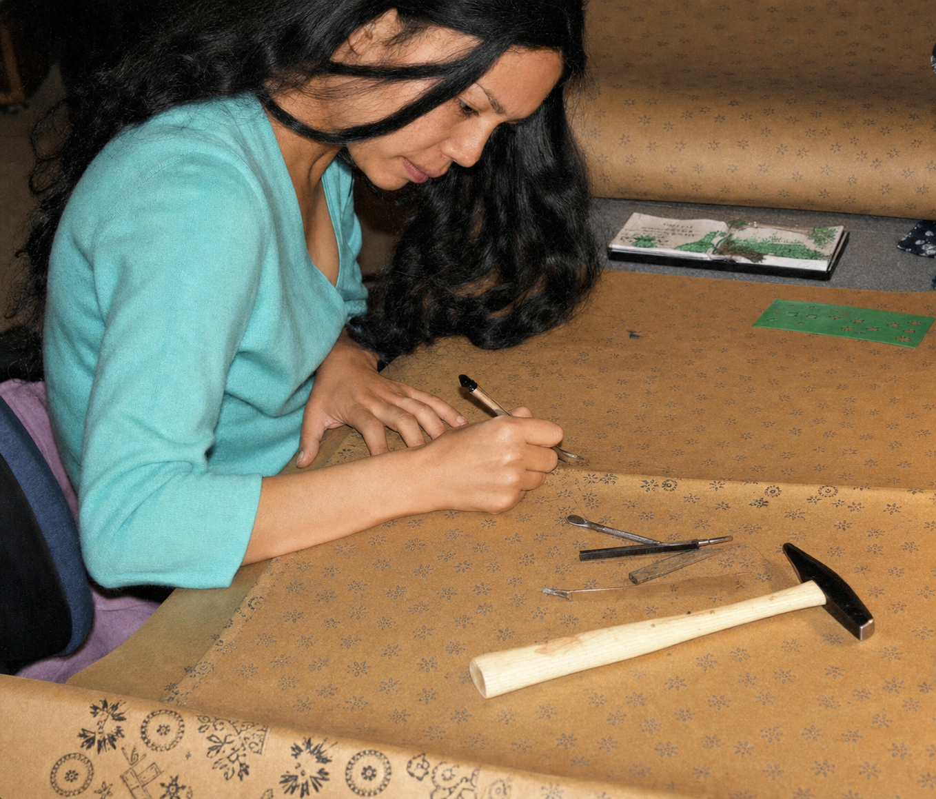 Shengzhu cutting a pattern template
